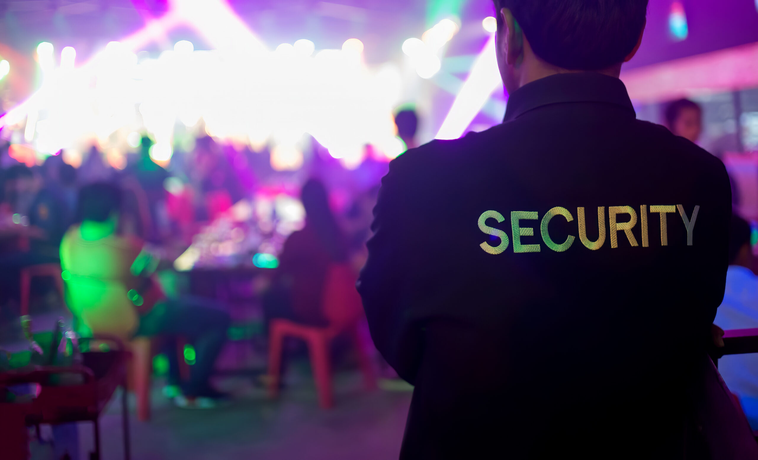 Event security officer watching over a busy venue